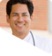 Photo of doctor in front of hospital.